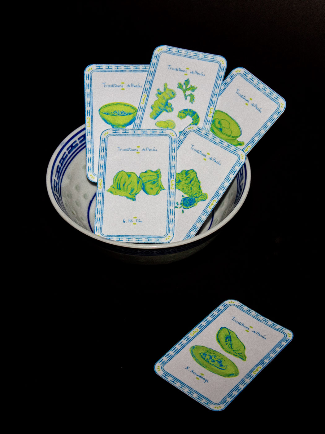 illustrated playing cards staged in a bowl