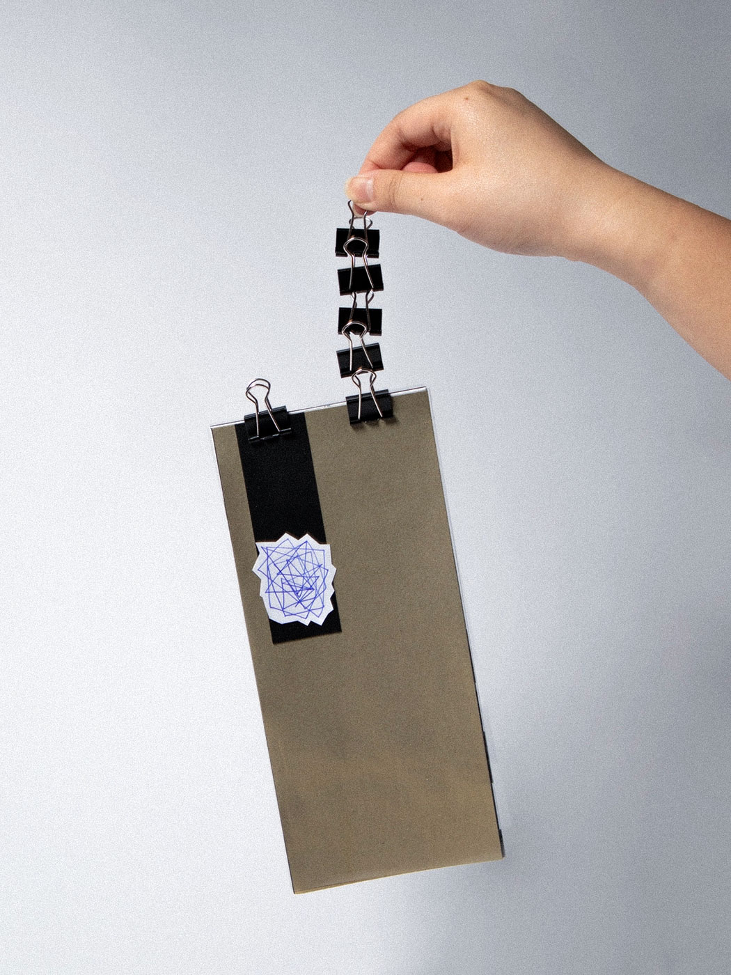micro edition held by paper clips